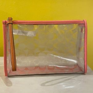 Pink coach makeup bag.
